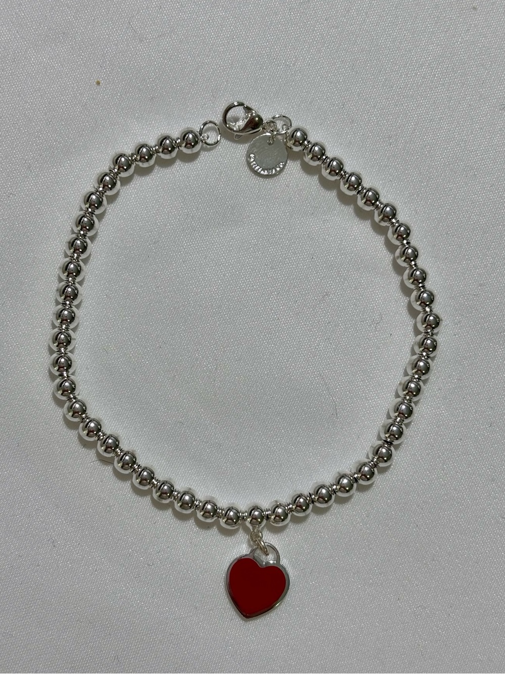 Tiffany & Co. Red Heart Bead Bracelet 7”
Excellent Used Condition - pouch & box